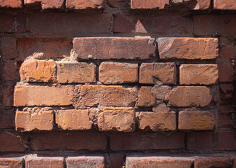 Obraz premium Old weathered brick wall close-up texture