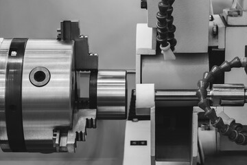 Industrial sharpening machine with large abrasive white disc sharpening round metal part,...