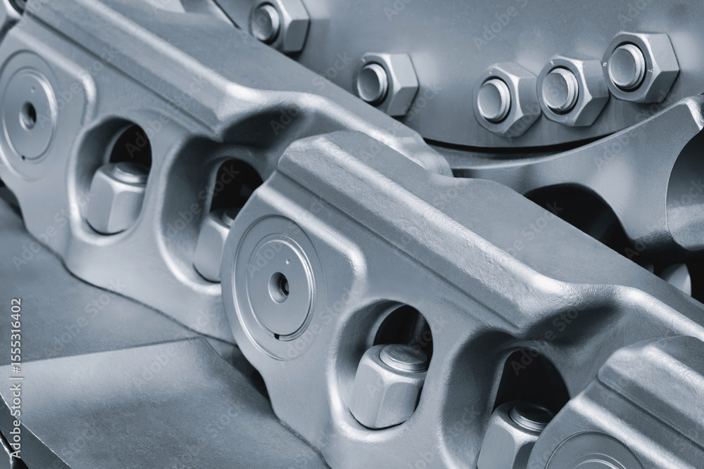 Aufkleber track Tractor on roller close up machine part many bolts and screws сoncept complexity precision, many parts fasteners work together create functioning machine