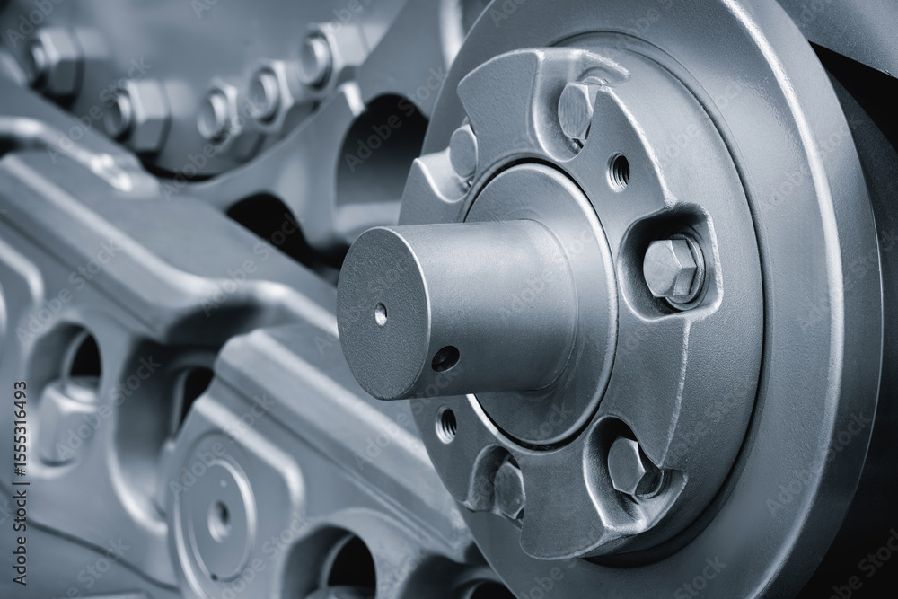 Aufkleber track Tractor on roller close up machine part many bolts and screws сoncept complexity precision, many parts fasteners work together create functioning machine