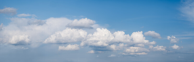 heaven sky is blue with many clouds. clouds are scattered throughout the sky and are of various...