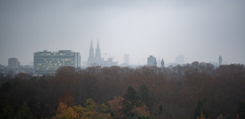 The urban cityscape of Cologne, with its Cologne Dome and other downtown buildings, forms a...