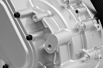 An intricate engine component is positioned prominently, highlighting its polished surface and...