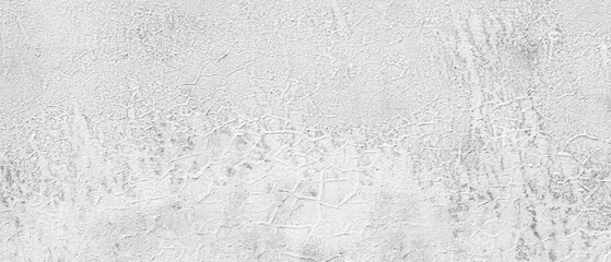 White gray wall with cracks and holes. wall is covered with white paint and has rough texture  background for  web banner template page