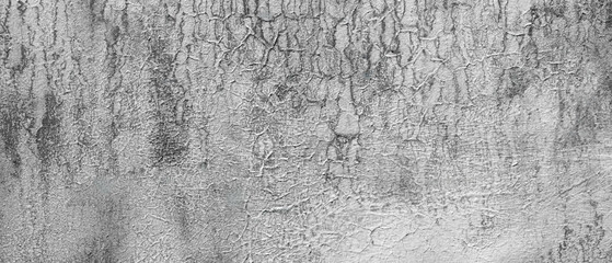 White gray wall with cracks and holes. wall is covered with white paint and has rough texture background for  web banner template page