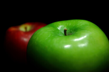 Fresh Green and Red Apples on a Black Background