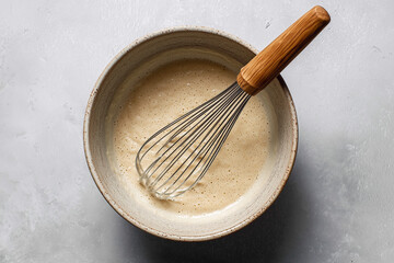 Whisk in a mixing bowl with creamy liquid batter; fresh batter mixture
