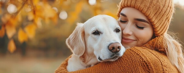 National dog day with cute companion idea. A woman embraces her dog in a cozy autumn setting.