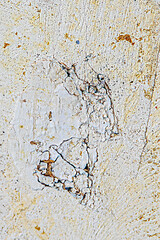 pattern of vintage historic plaster wall after removing the wallpaper in different historic colors as symbol of grunge and time