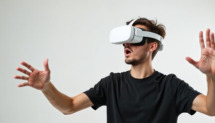 Surprised young man uses VR glasses exploring virtual world. He reaches out, interacts with tech. Digital gadgets for entertainment, work, free time study. Metaverse experience.
