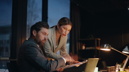 Night employees arguing virtual meeting quarrelling by office laptop closeup