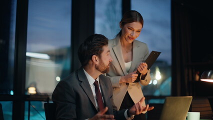 Businesspeople talking virtual meeting laptop in late creative agency closeup
