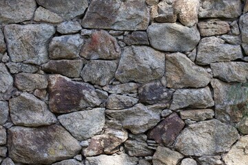 Fototapeta premium A wall made of large rocks