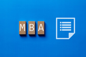 There is wood block with the word MBA. It is an abbreviation for Master of Business Administration...