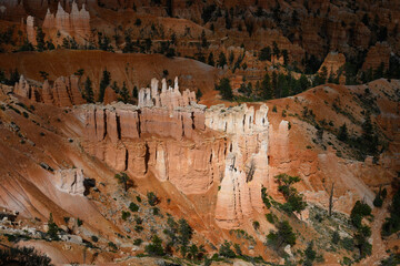 Natural geologic marvel of erosion on rocks to create beautiful hoodoos in an amphitheater, summer vacation exploring in Bryce Canyon National Park, Utah
