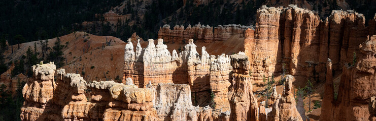 Natural geologic marvel of erosion on rocks to create beautiful hoodoos in an amphitheater, summer vacation exploring in Bryce Canyon National Park, Utah
