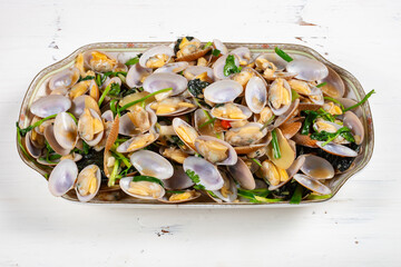 angle view dish of fresh homemade stir-fried clams at horizontal composition