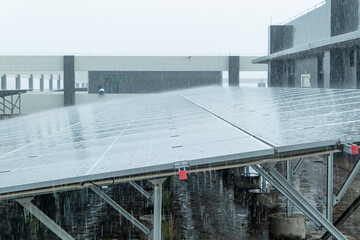 solar panels in heavy rain at horizontal composition