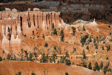 View from canyon rim of hoodoos and the queens loop hiking trail, summer vacation exploring in Bryce Canyon National Park, Utah
