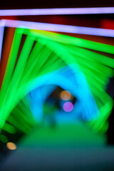 out-of-focus colorful light trails at vertical composition as background