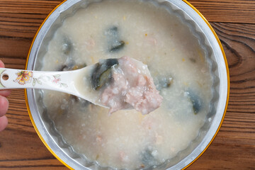 top view porridge with pork and preserved egg