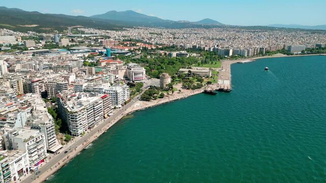 Aerial perspective of Thessaloniki's modern waterfront district with apartment blocks facing the sea