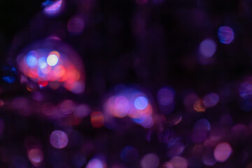Abstract colorful purple bokeh background at night
