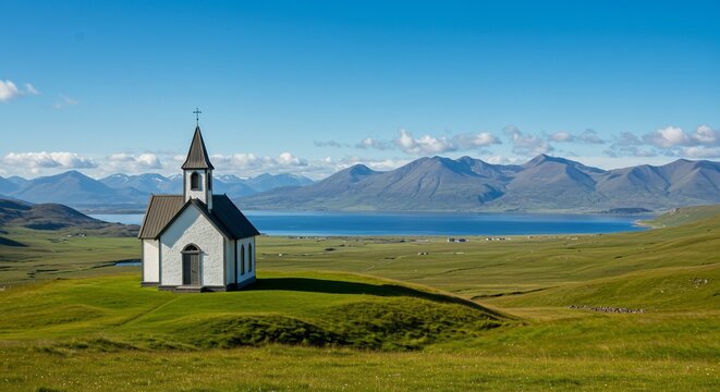 Serene White Church Overlooking Vast Green Valley and Distant Mountains Under Blue Sky