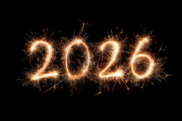 2026 drawn with glowing sparklers on black night background