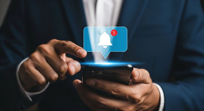 Man holding a smartphone with a social media notification symbol above it. Digital communication, business concept for modern technology.