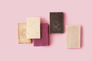 Set of natural soap bars on pink background