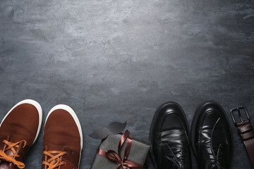 Paper mustache with male shoes on dark background. Father's Day celebration