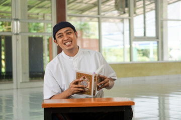 Asian moslem man show praying at mosque show faith believe to god. Religion, islamic photo concept