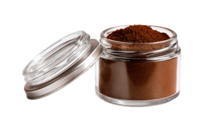 Coffee powder in a glass jar with a silver lid, on a white isolated background.