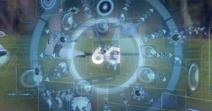 Showing futuristic 6G interface over grass field with concentric rings, globe icons and sports ball - Powered by Adobe