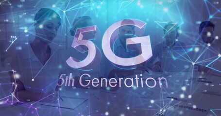 Collaborating business professionals reviewing documents around conference table, with 5G overlay