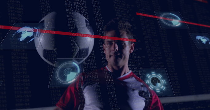 Athlete wearing red jersey balancing soccer ball on fingertip in studio, with holographic overlays