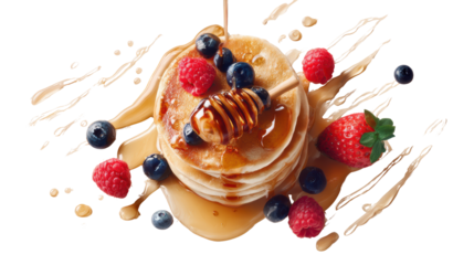 Delicious stacked pancakes topped with berries and honey, isolated on a white background.