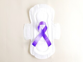 Sanitary napkins with purple bands symbolize endometriosis or menstrual cycle awareness. Women's...