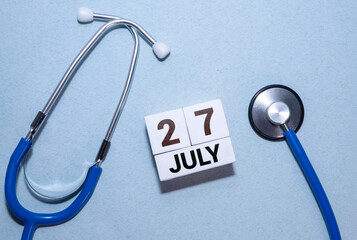 July 27th. Image of july 27, calendar on yellow background.