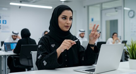 Confident Emirati businesswoman leads a modern office team meeting.