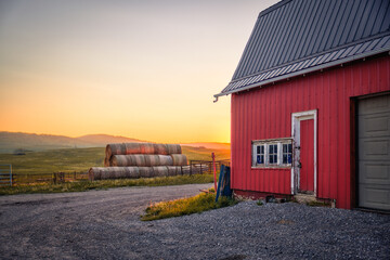 Longview, Alberta - June 8, 2025: Out buildings and landscapes on the Tongue Creek Ranch at sunset
