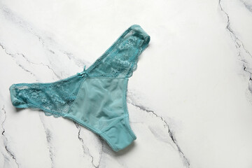 Lace female panties on light background