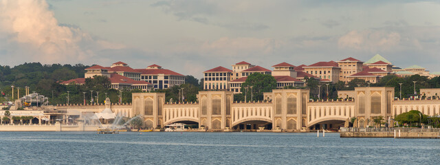 Putrajaya, Malaysia - Feb. 20, 2025: Panoramic view of Seri Gemilang Bridge and government buildings across Putrajaya Lake
