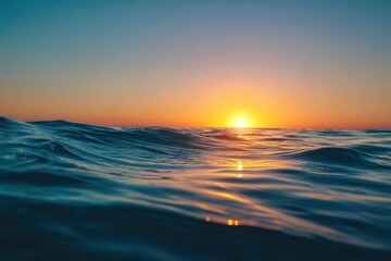 Obraz premium Beautiful Ocean Waves at Sunset with Reflection of Golden Sun on Water Surface