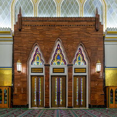 Stunning stained glass doors adorn side entrance of Omar Ali Saifuddien Mosque, highlighting its Islamic architecture in Bandar Seri Begawan, Brunei