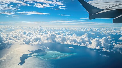 Aerial view of clouds and ocean from airplane window