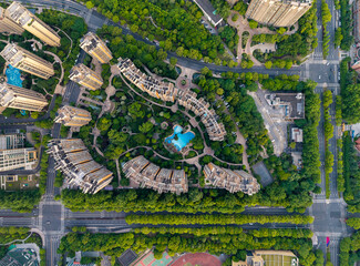 Aerial view of a densely populated residential neighborhood featuring modern buildings surrounded...