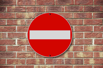 No entry sign on a brick wall background