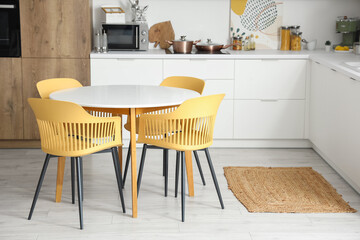 Clean white table in interior of modern kitchen